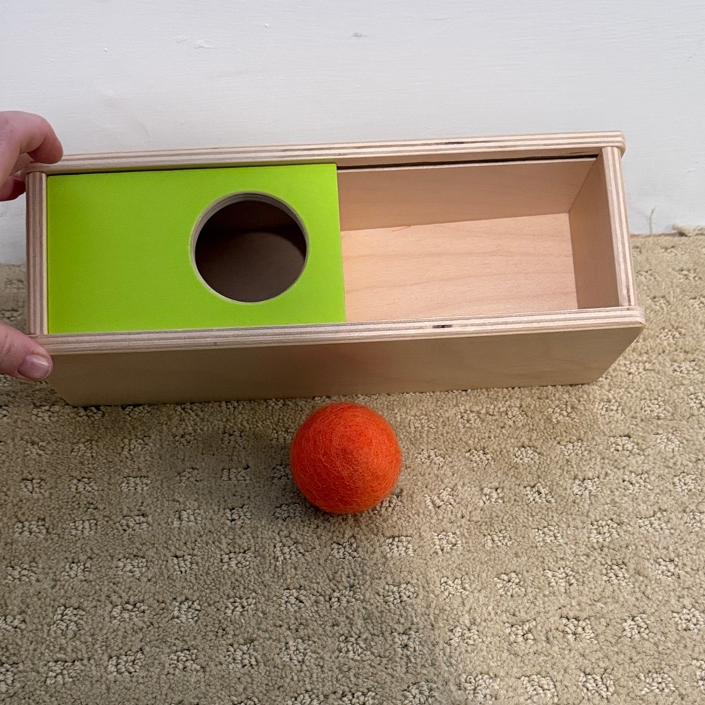 Lovevery Sliding Top Box with Soft Orange Ball